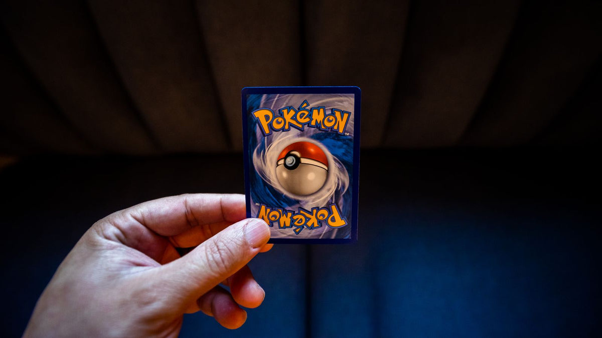 Holding a Pokémon card up to check if it is real